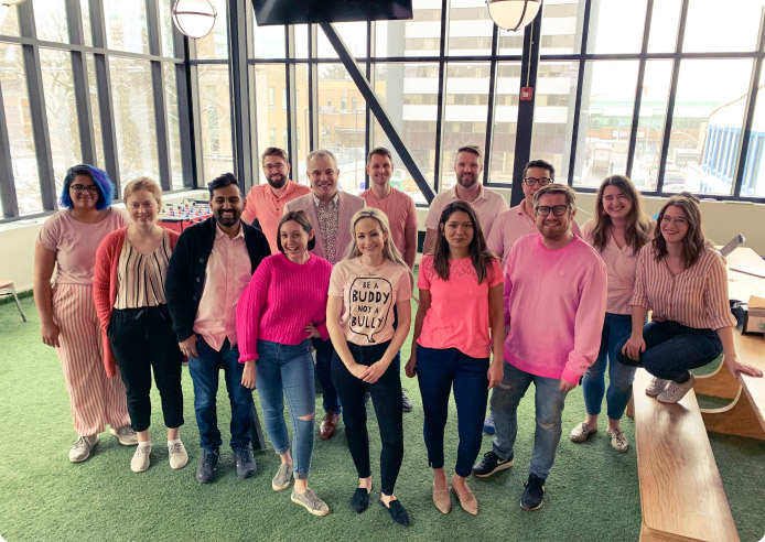 Group photo of smiling employees