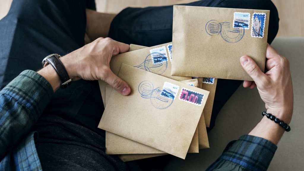 person sorts through mail